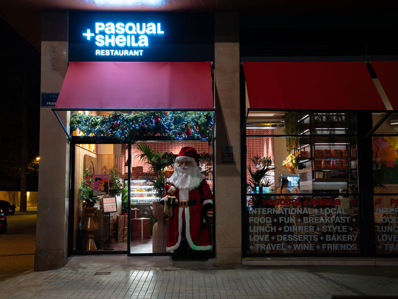 PASQUAL+SHEILA — restaurant exterior at night